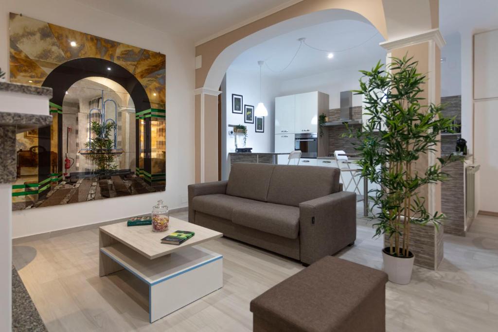 a living room with a couch and a table at Casa Vacanze Aurora in Fiumicino