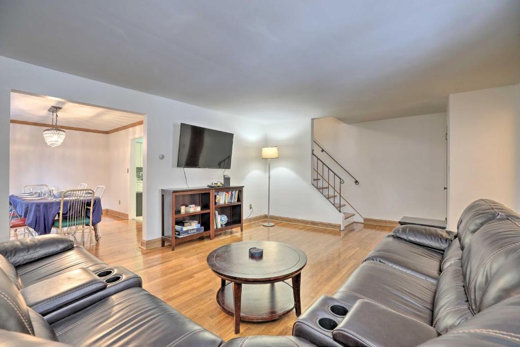 a living room with a couch and a table at Pittsburgh Townhome about 5 Miles to Market Square in Pittsburgh