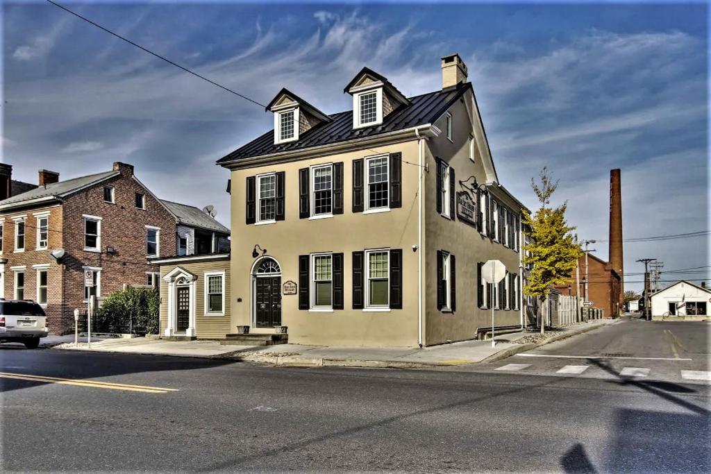 a white house on the corner of a street at Downtown Bucher House in Hanover