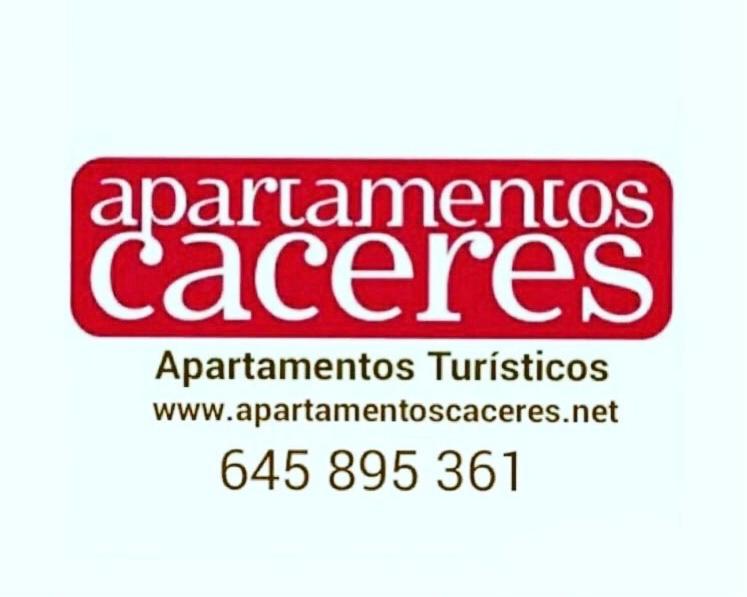 a red sign that saysarmenariosucesuces with at Apartamentos Caceres in Cáceres