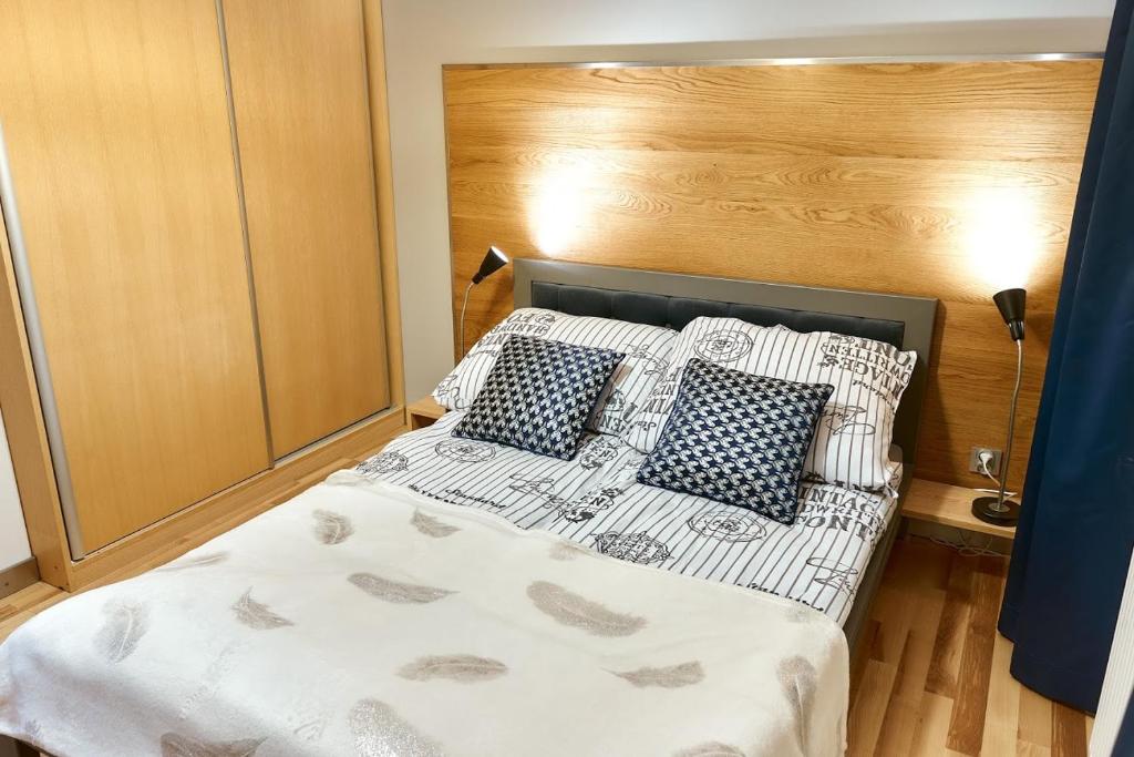 Posteľ alebo postele v izbe v ubytovaní LAGUNA Apartament 7 Willa Maria