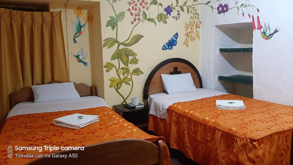 Postel nebo postele na pokoji v ubytování Hostal sambleño cusco Piero suite
