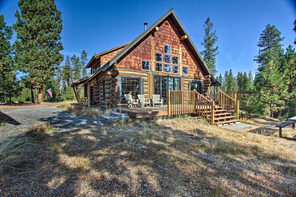 a log cabin with a porch and a deck at Snow Pine Retreat - Secluded Crescent Escape! in Crescent
