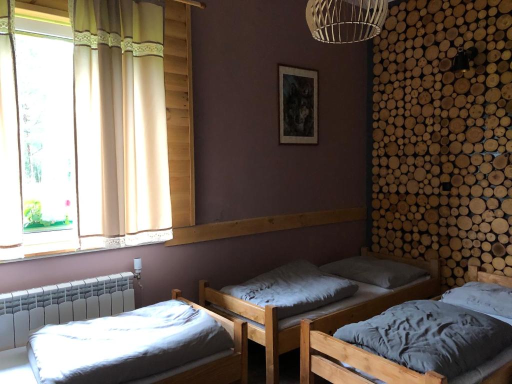 Posteľ alebo postele v izbe v ubytovaní Latarnia Wagabundy Bieszczady