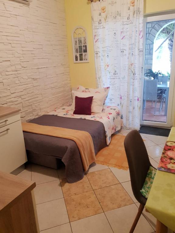 Postel nebo postele na pokoji v ubytování Villa Mateja