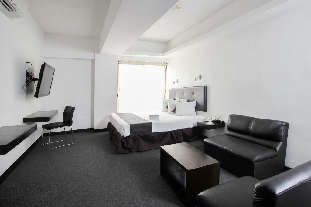 TV a/nebo společenská místnost v ubytování Hotel Maya Yucatan
