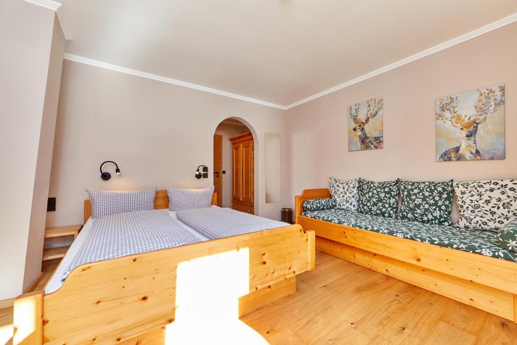 Postel nebo postele na pokoji v ubytování Gästehaus Brandnerhof