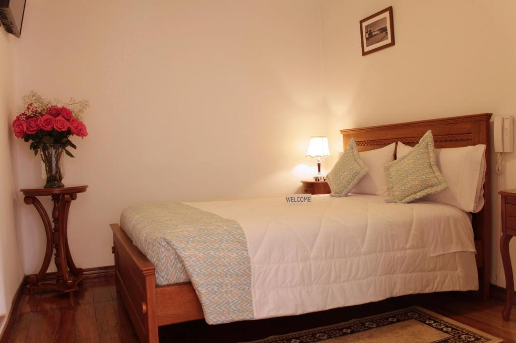 Postel nebo postele na pokoji v ubytování Casa Hotel Las Plazas
