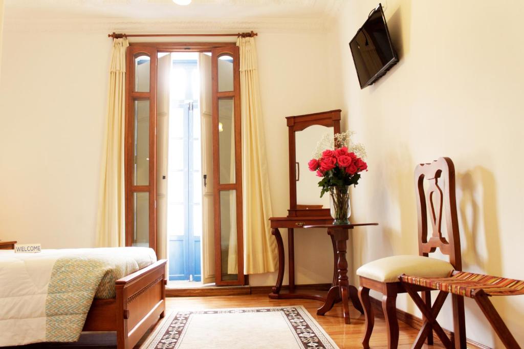 TV a/nebo společenská místnost v ubytování Casa Hotel Las Plazas