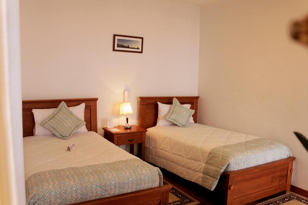 Postel nebo postele na pokoji v ubytování Casa Hotel Las Plazas