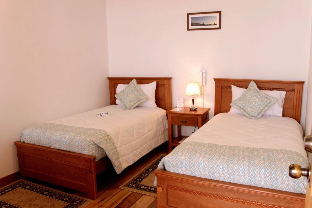 Postel nebo postele na pokoji v ubytování Casa Hotel Las Plazas