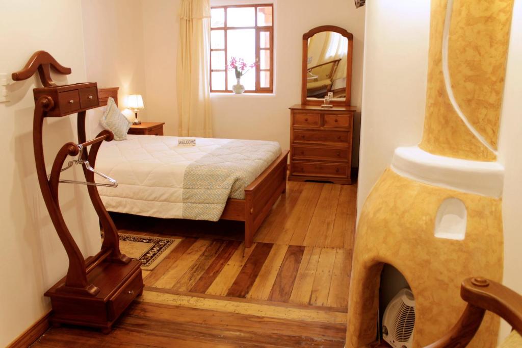 Postel nebo postele na pokoji v ubytování Casa Hotel Las Plazas