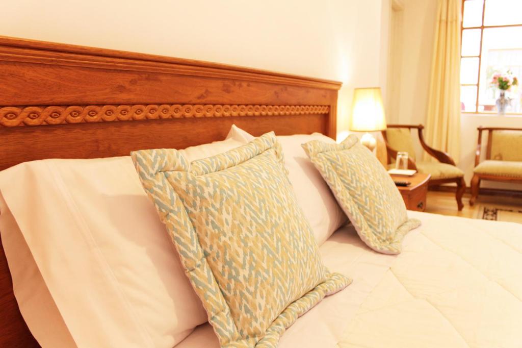 Postel nebo postele na pokoji v ubytování Casa Hotel Las Plazas