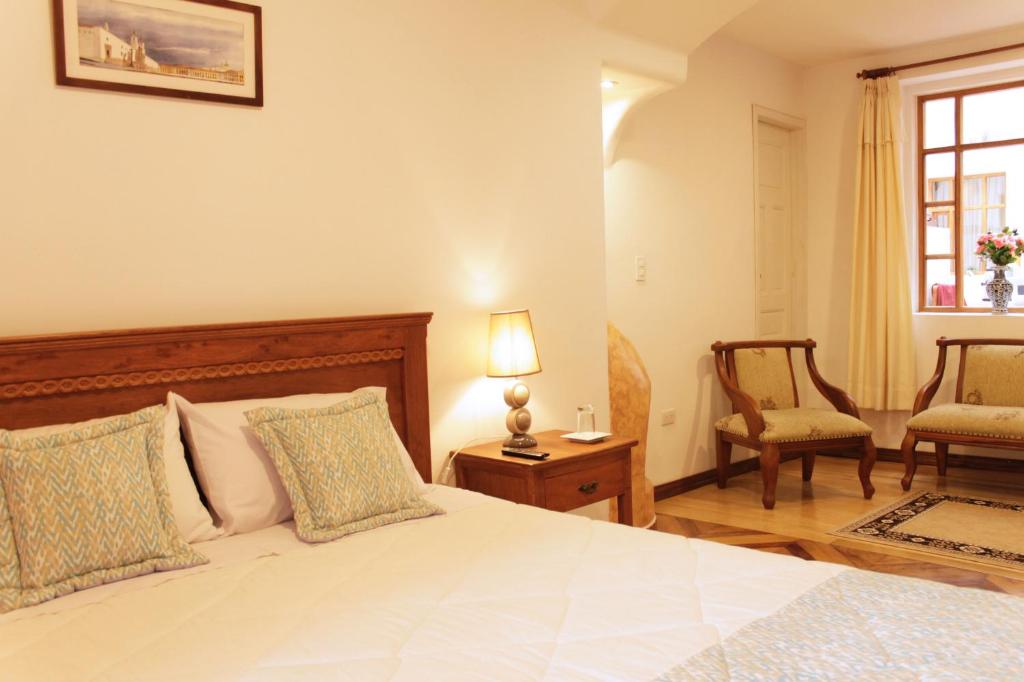 Postel nebo postele na pokoji v ubytování Casa Hotel Las Plazas