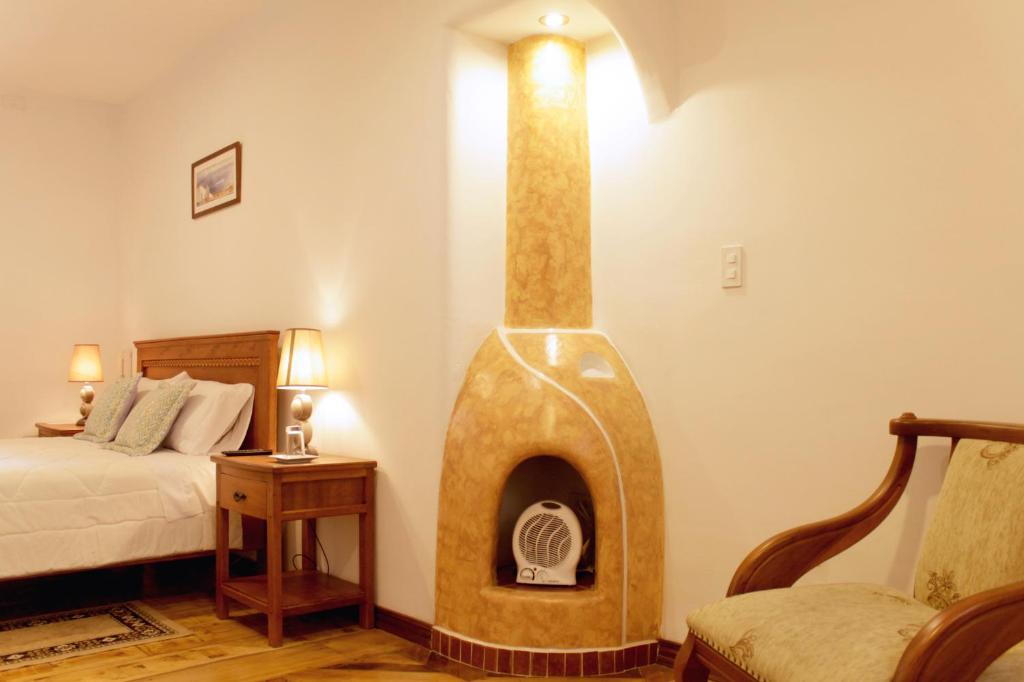 Postel nebo postele na pokoji v ubytování Casa Hotel Las Plazas