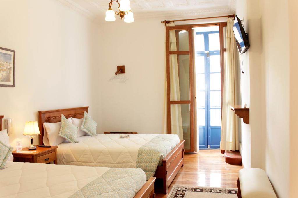 Postel nebo postele na pokoji v ubytování Casa Hotel Las Plazas