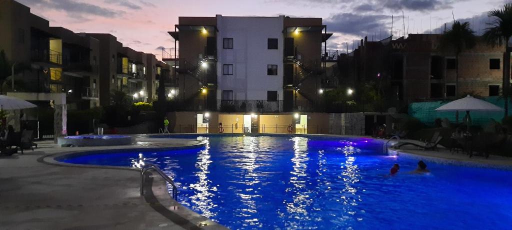 a swimming pool in a city at night at Apartasol Reserva La Colina in La Tebaida