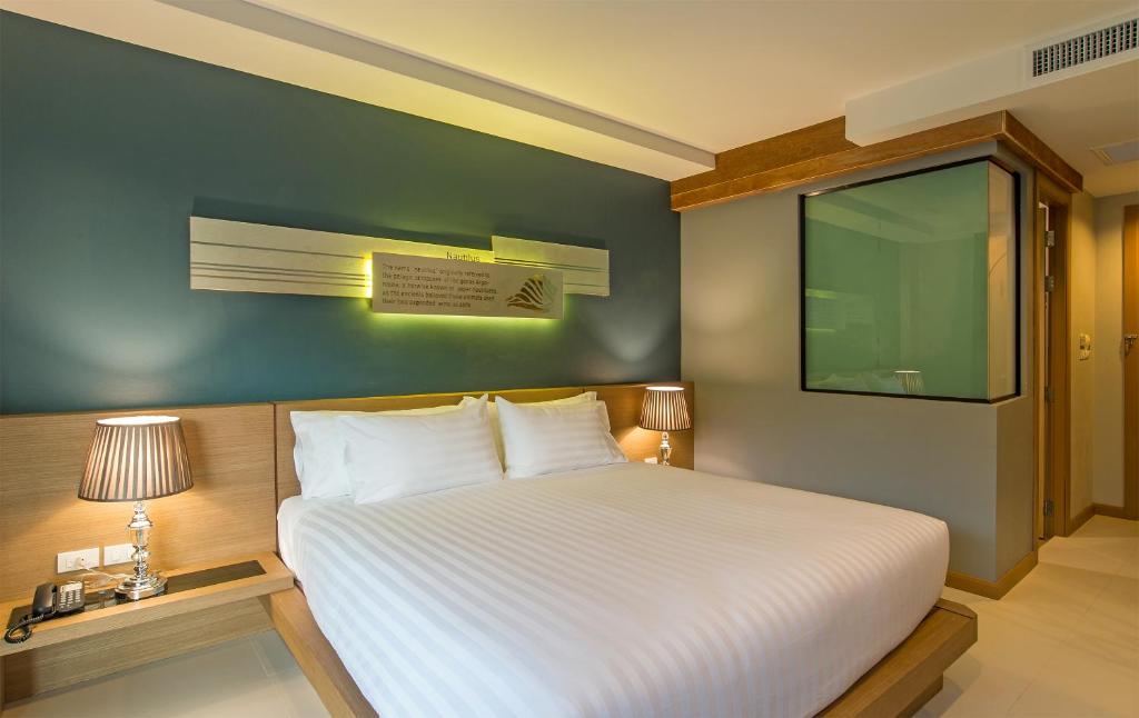 Postel nebo postele na pokoji v ubytování AVA SEA Resort Krabi, Ao Nang Beach
