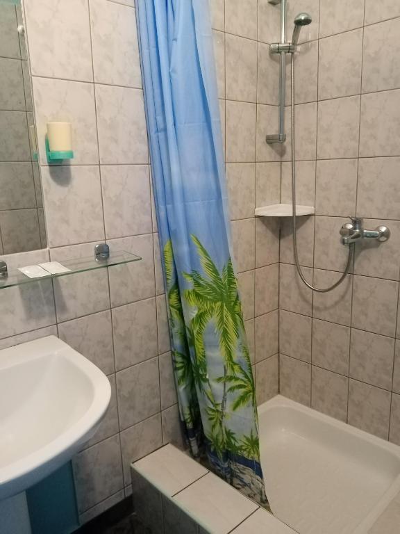 Koupelna v ubytování Gamma Hotel