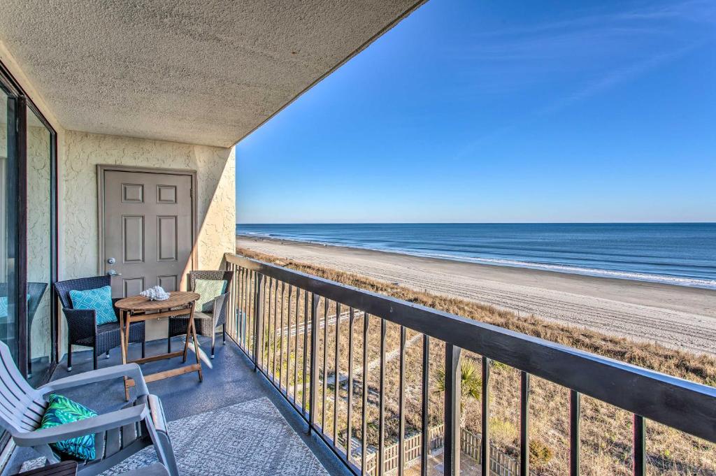 a balcony with a view of the beach at Luxury Myrtle Beach Condo Oceanfront with Hot Tub! in Myrtle Beach