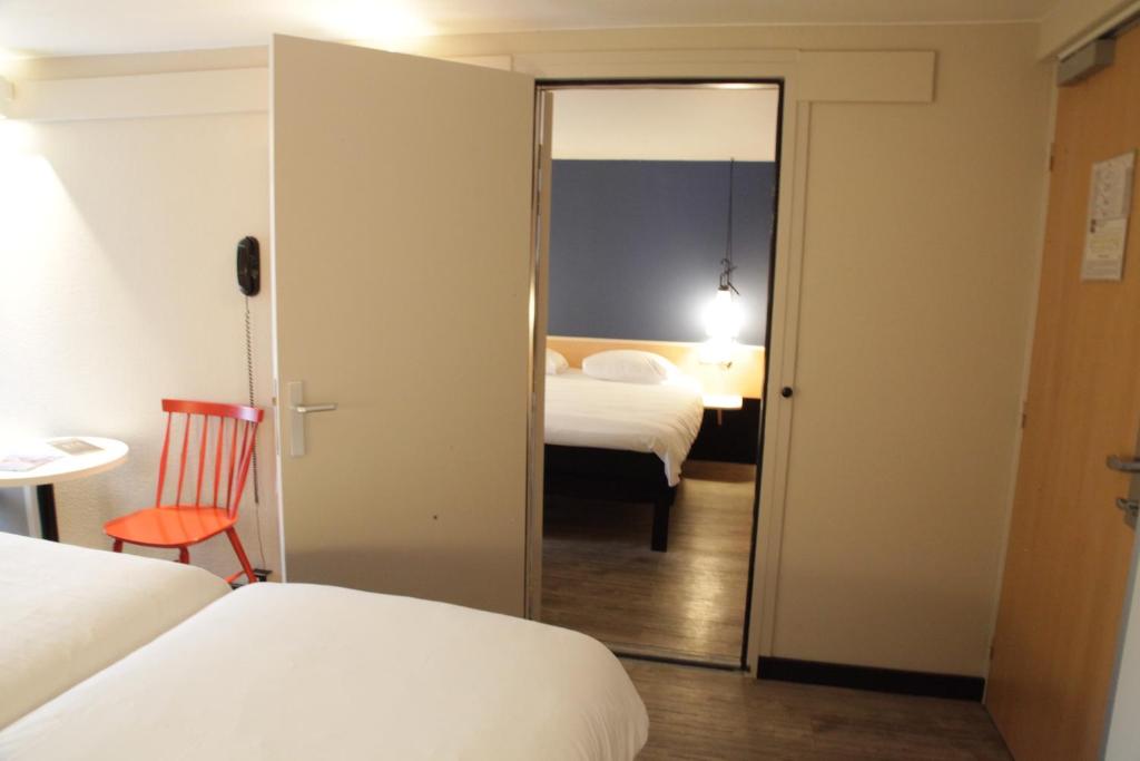 Postel nebo postele na pokoji v ubytování ibis Brest Kergaradec