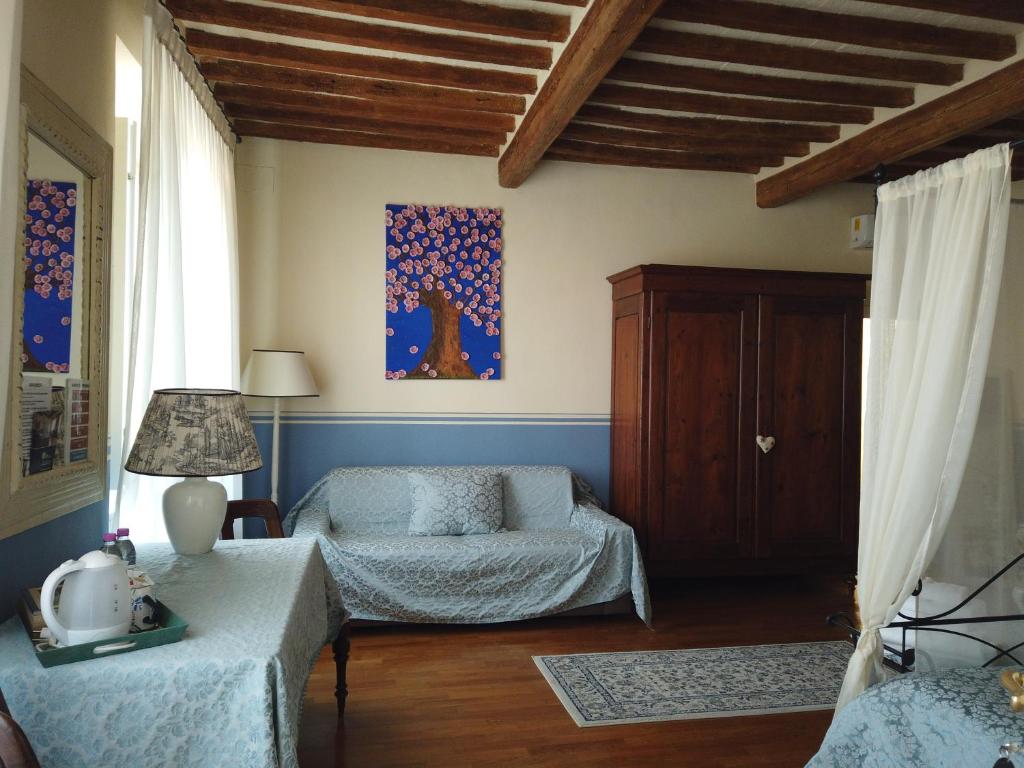 Postel nebo postele na pokoji v ubytování B&B Attico sulla Torre