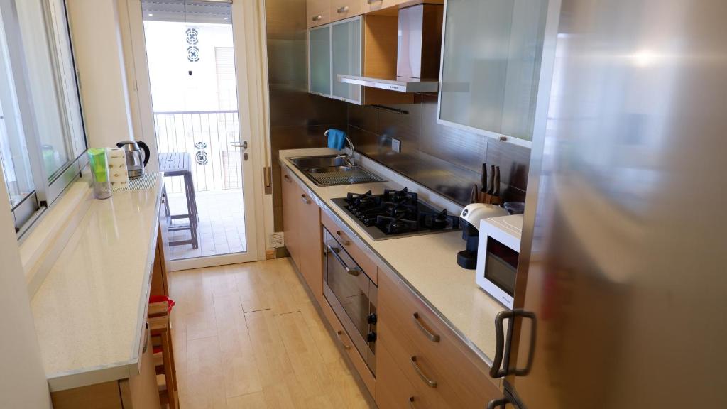 A kitchen or kitchenette at App4rent Augustus Sea View - Family House - wifi&parking - 3 rooms