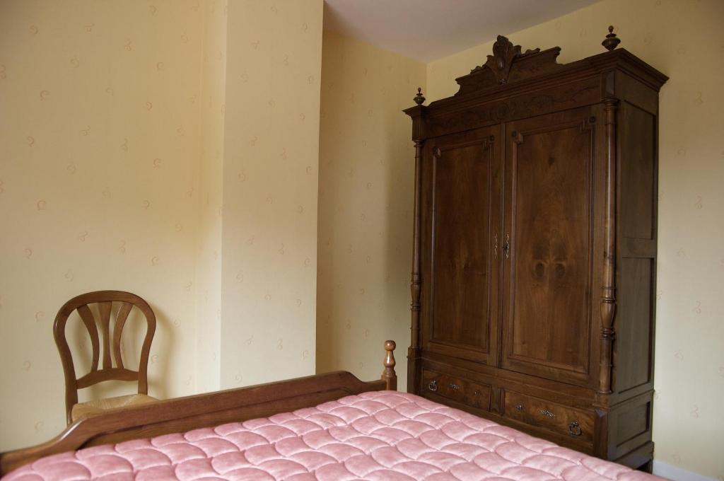 Postel nebo postele na pokoji v ubytování Hôtel Ladagnous