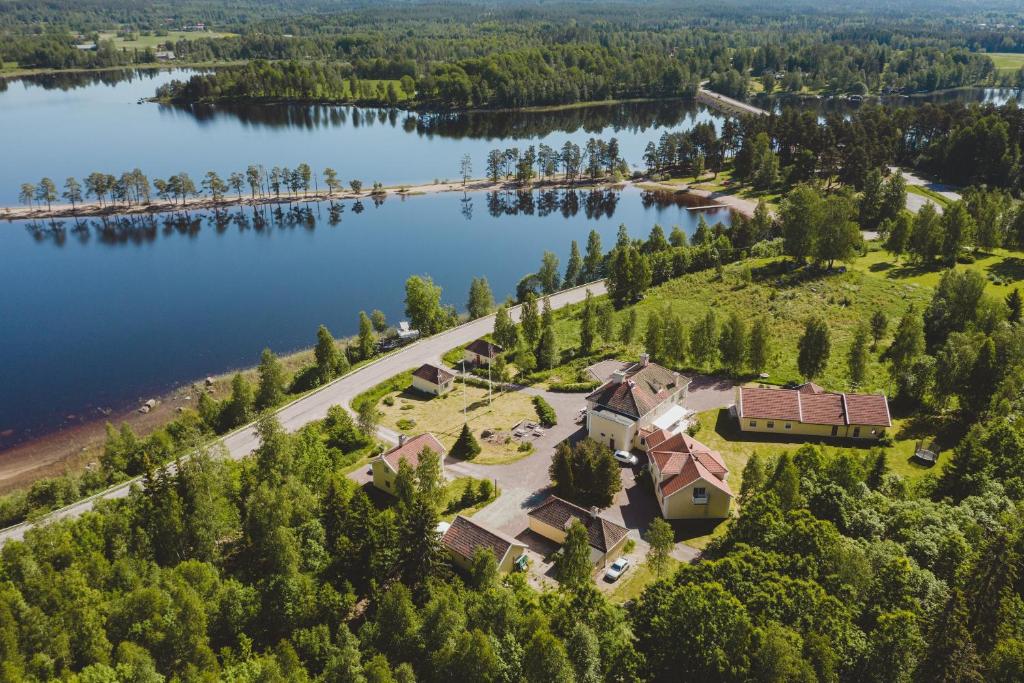 an aerial view of a house on the shore of a lake at Trollnäs Hotell in Svärdsjö