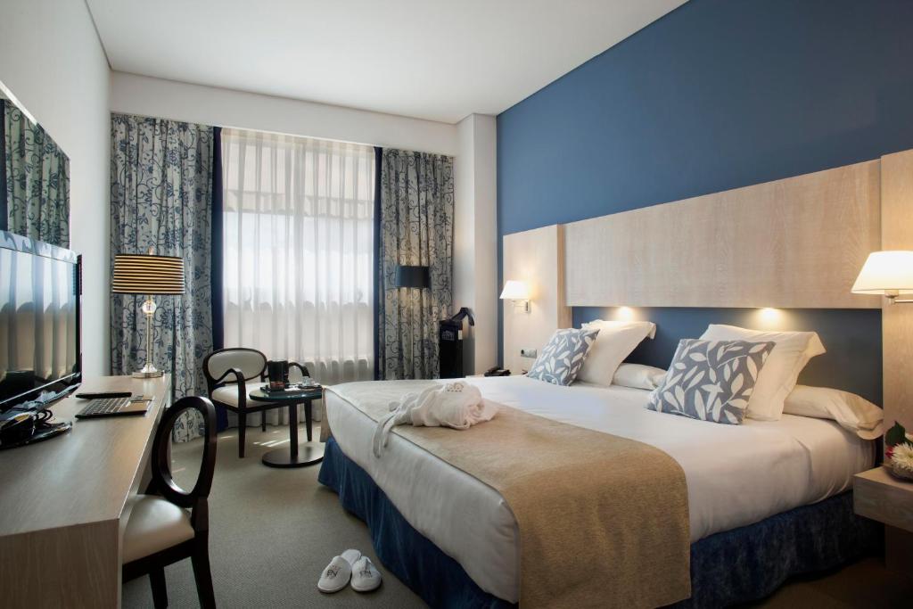 Cama o camas de una habitación en Hotel Nuevo Boston