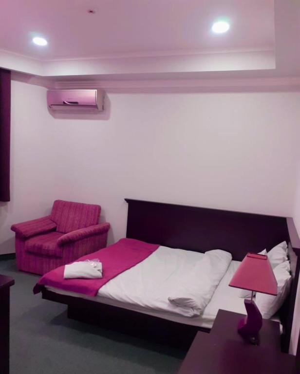 Postel nebo postele na pokoji v ubytování DDD Hotel