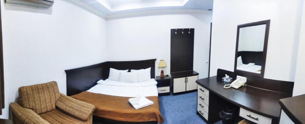 Postel nebo postele na pokoji v ubytování DDD Hotel