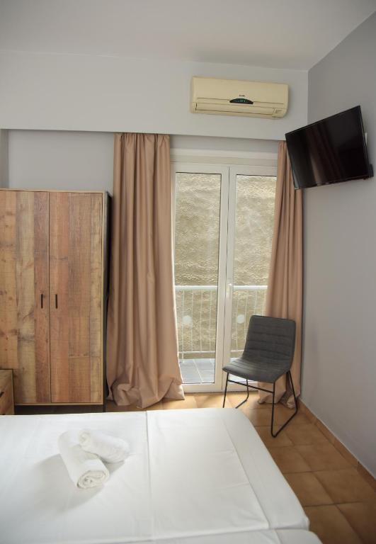 Postel nebo postele na pokoji v ubytování Platon Hotel