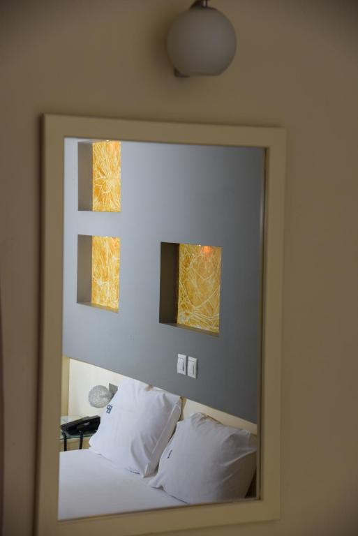 Postel nebo postele na pokoji v ubytování Platon Hotel