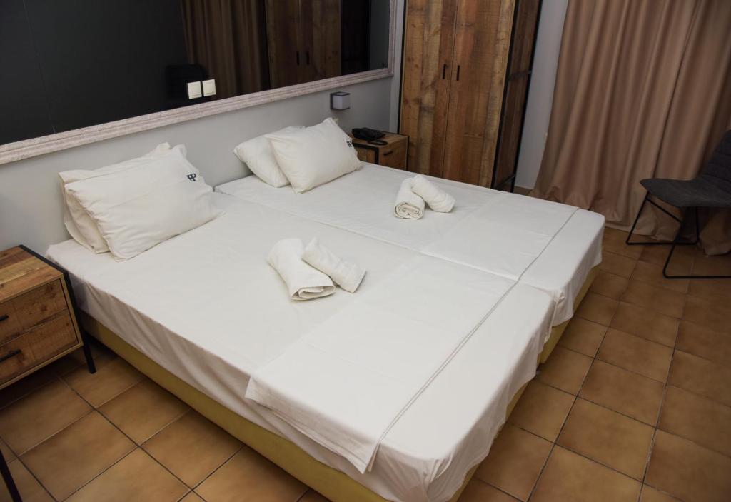 Postel nebo postele na pokoji v ubytování Platon Hotel