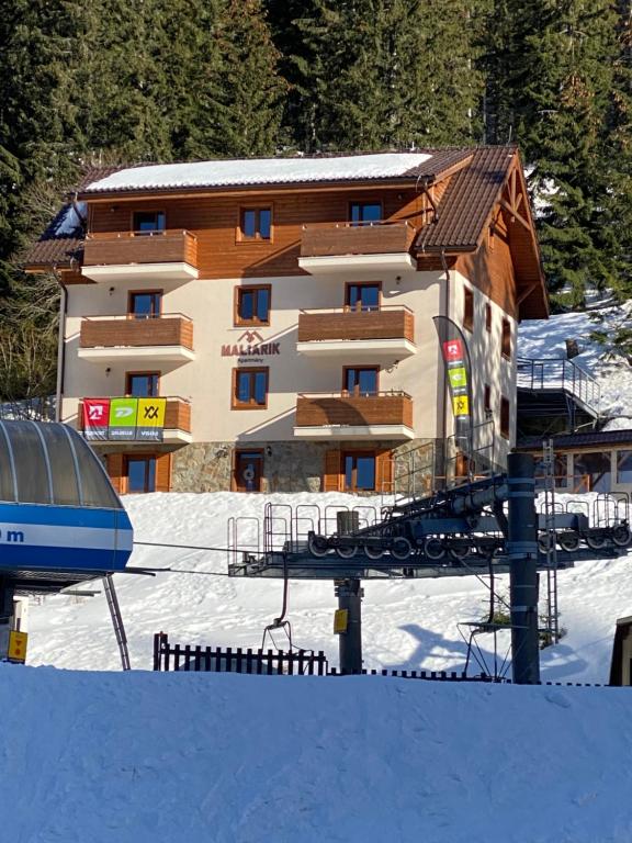 L'établissement Maliarik – Apartmán Deluxe en hiver