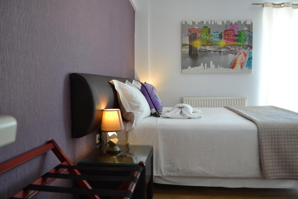 Ένα ή περισσότερα κρεβάτια σε δωμάτιο στο Rivitel Marousi Apartments
