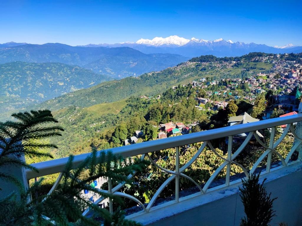 a view of a city with mountains in the background at Beautiful View Homestay in Darjeeling