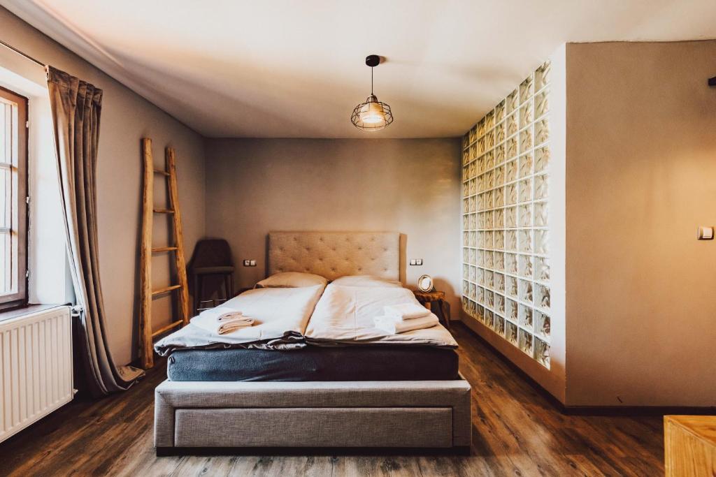 Postel nebo postele na pokoji v ubytování Resort Mlýn Černovice