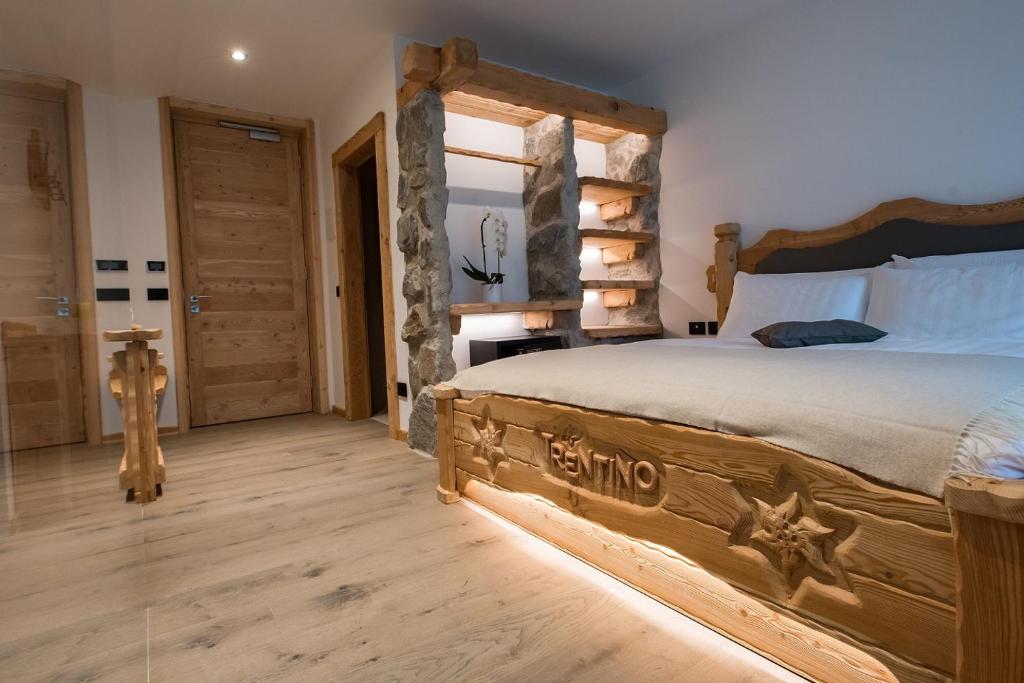 Postel nebo postele na pokoji v ubytování Hotel Chalet Al Foss