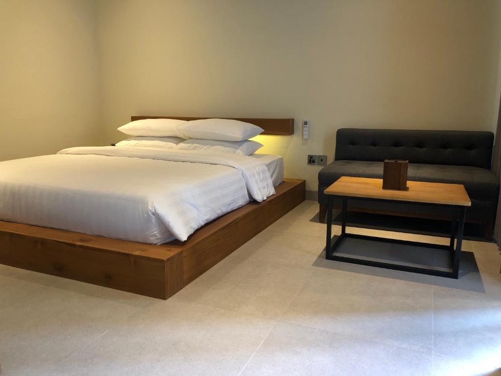 Postel nebo postele na pokoji v ubytování Rumah Kahyangan