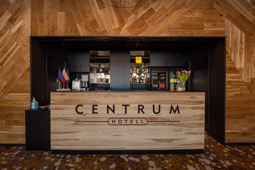 a bar with a sign that reads centrum hotel at Centrum Hotel Viljandi in Viljandi