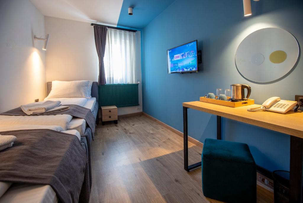 Postel nebo postele na pokoji v ubytování Hotel 4 Llulla