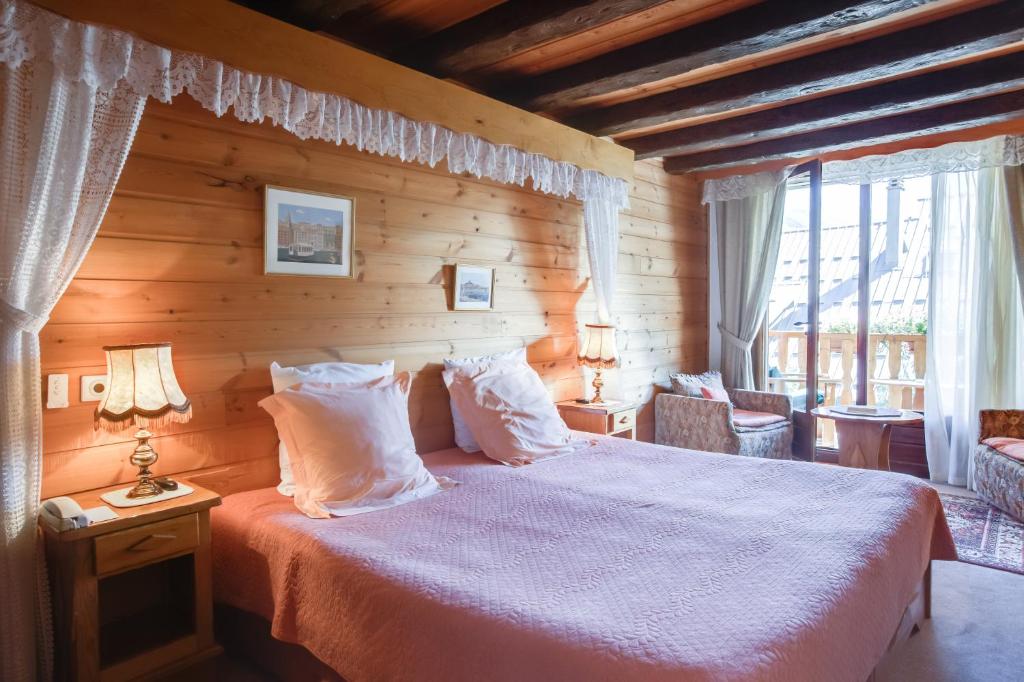 Postel nebo postele na pokoji v ubytování L'Auberge du Choucas