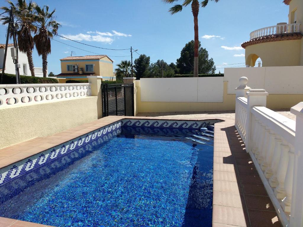 a swimming pool in the backyard of a house at AME737 in Les tres Cales