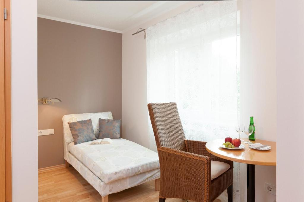 Postel nebo postele na pokoji v ubytování Merker's Hotel & Restaurant Bostalsee