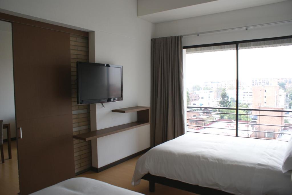 Postel nebo postele na pokoji v ubytování Hotel Viaggio Nueve Tres