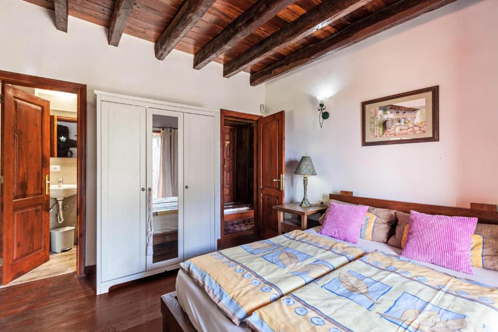 Postel nebo postele na pokoji v ubytování Finca Los Viñedos Casa Rural