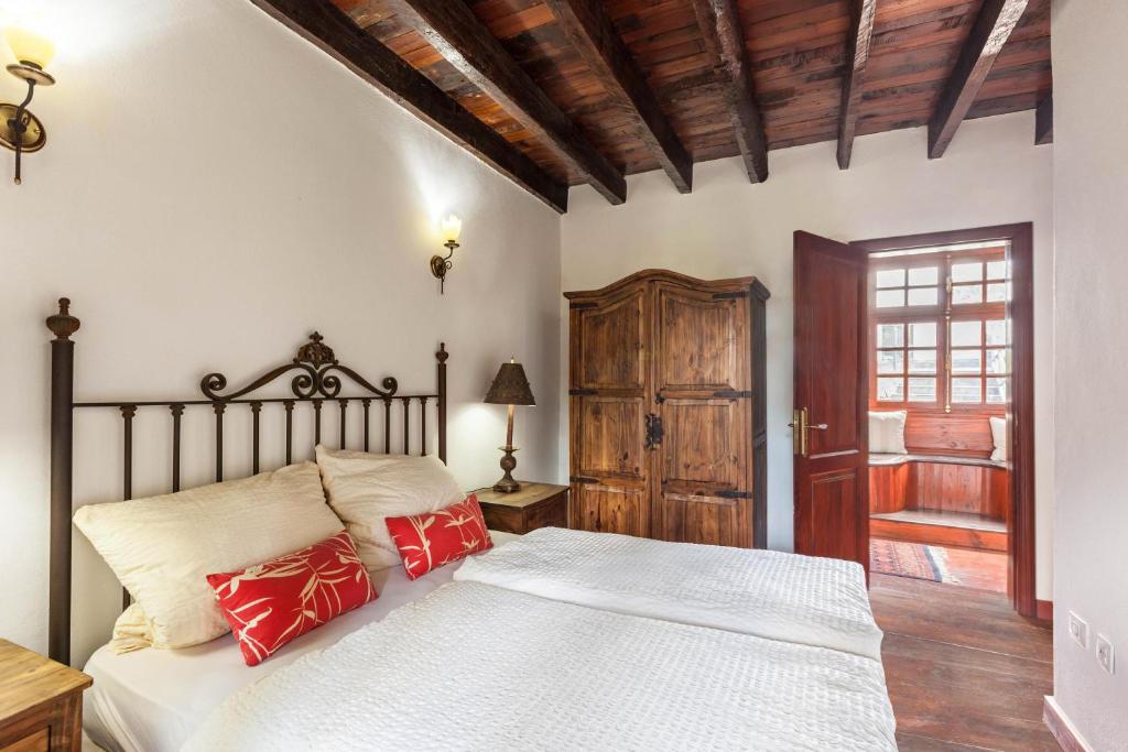 Postel nebo postele na pokoji v ubytování Finca Los Viñedos Casa Rural