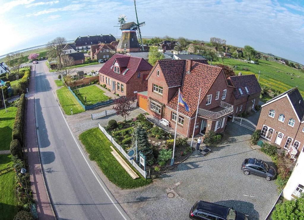 an aerial view of a house with a windmill at Haus Emanuel in Nordstrand